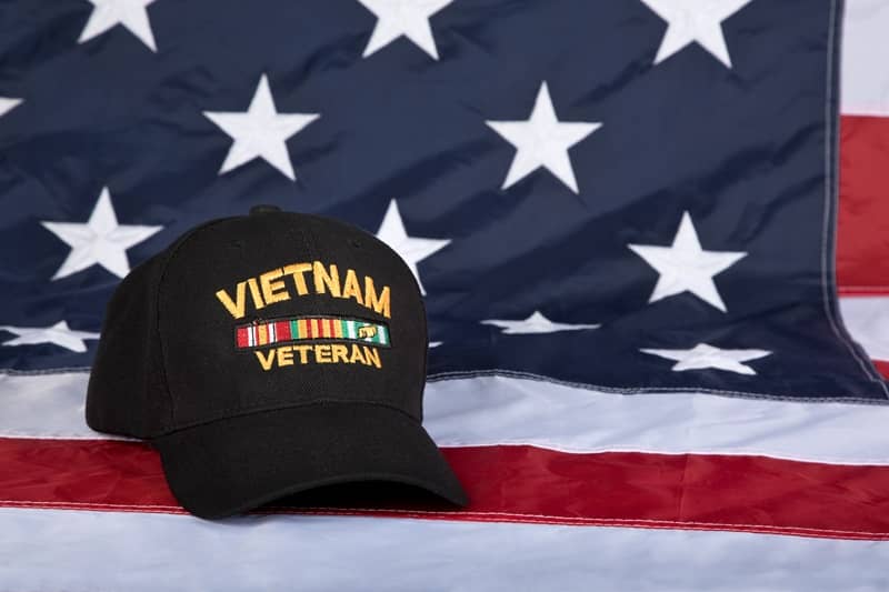 Vietnam Veterans cap with American Flag background-cm